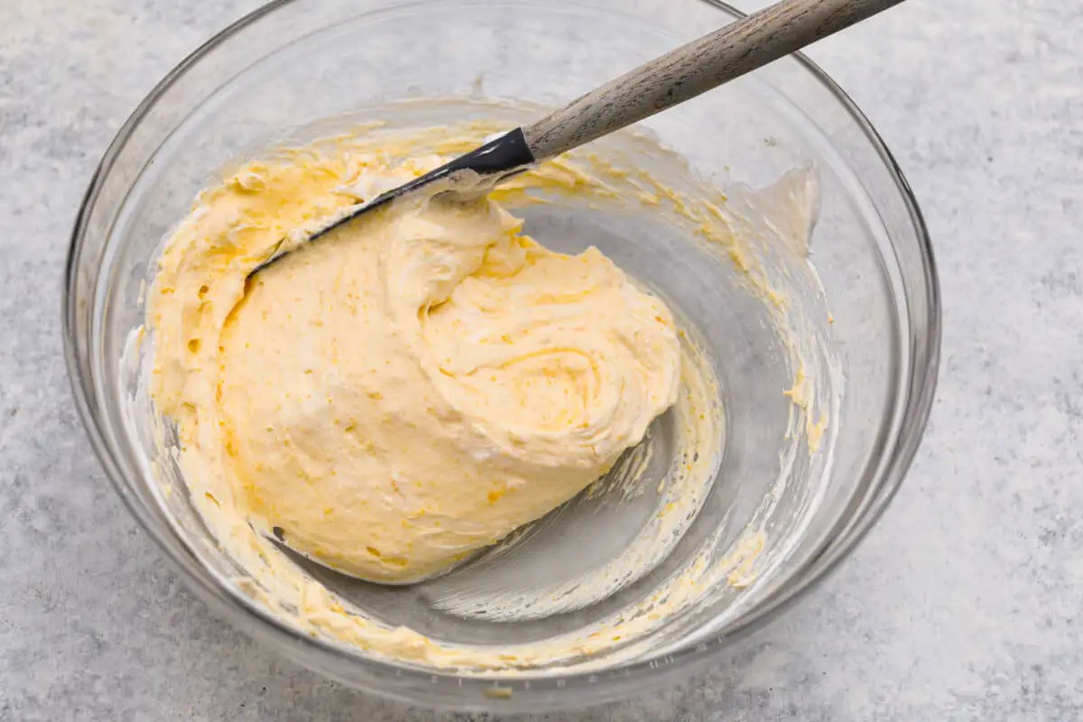 Fourth process photo of whipped cream folded into the lemon filling. - Lemon Angel Pie