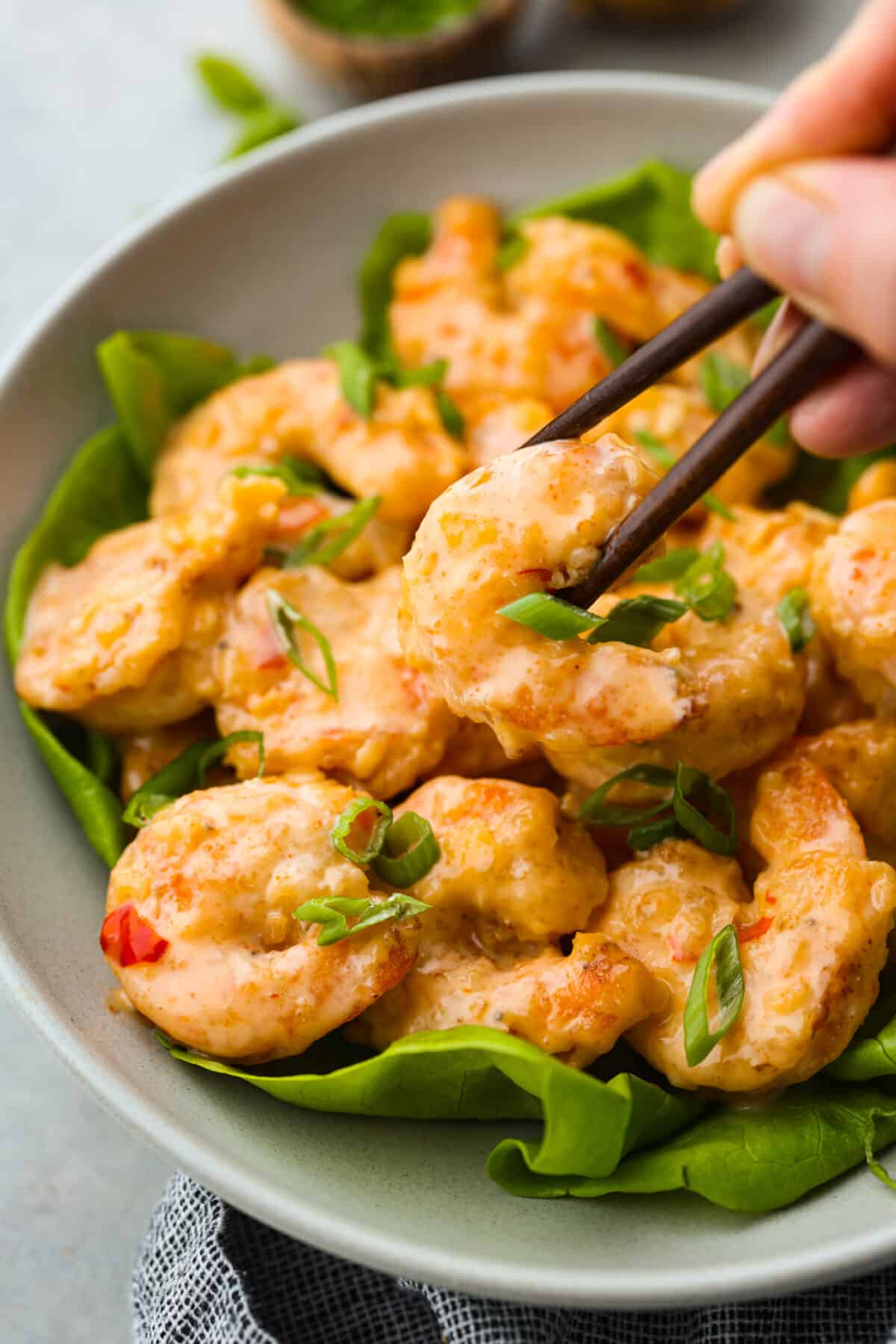 Picking up a piece of shrimp with chopsticks - Copycat Bang Bang Shrimp