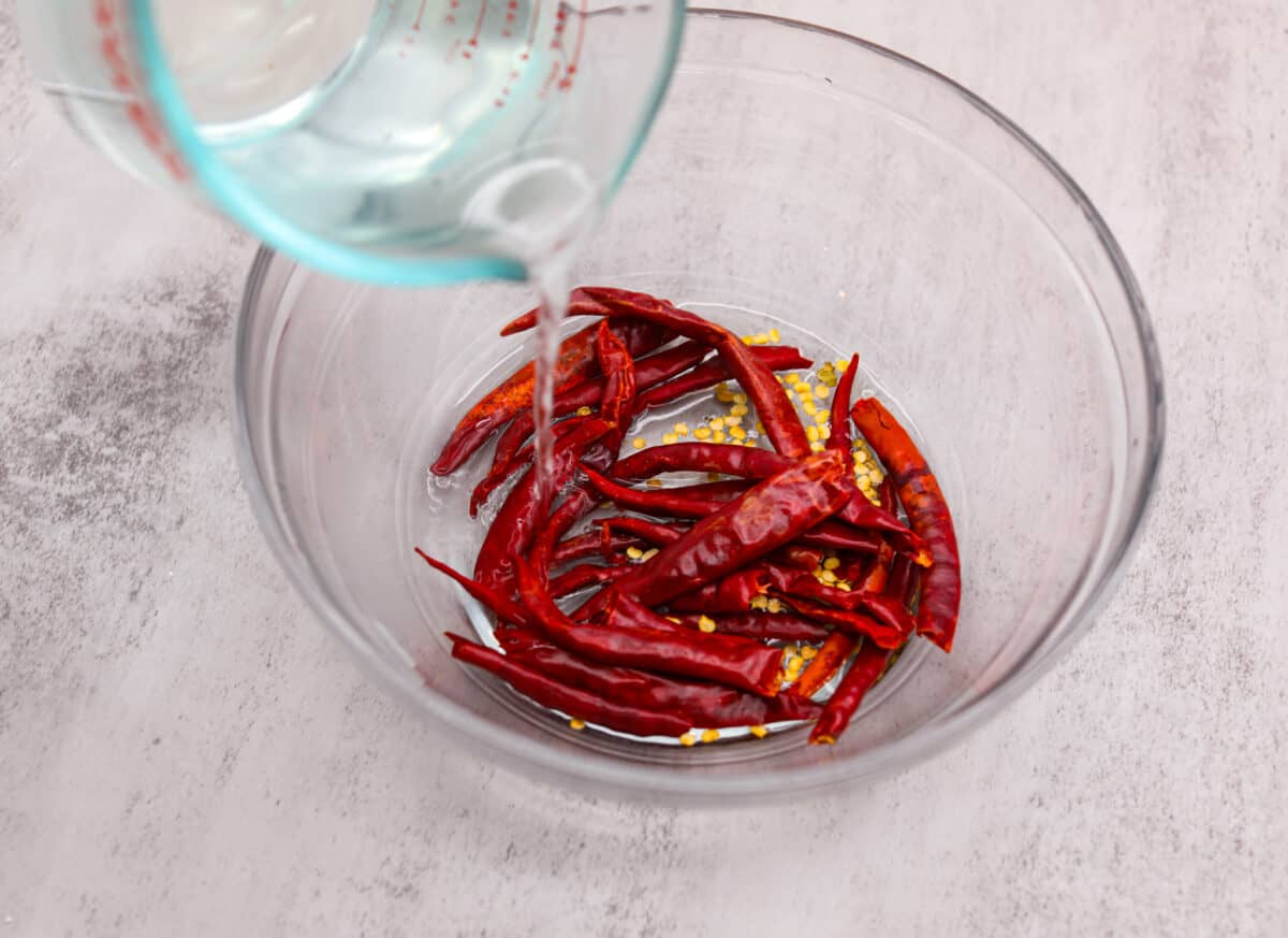 Covering dried peppers with water. - Homemade Hot Sauce