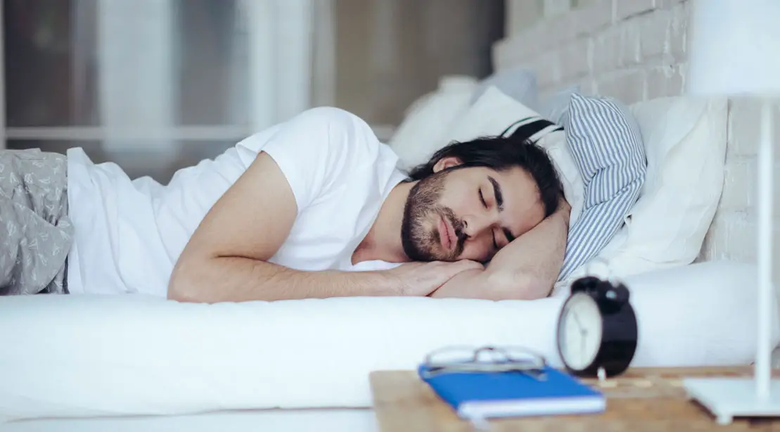 Man Sleeping - Can You Sleep Your Way To A Slimmer Physique? Science Says Yes