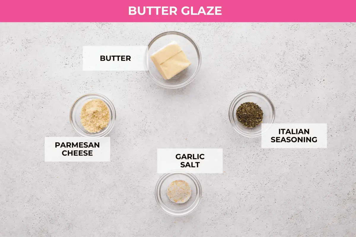 The butter glaze ingredients- butter, parmesan cheese, and Italian seasoning. - Grinder Sliders