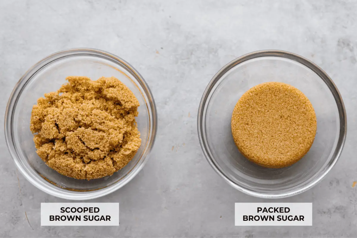 A photo of scooped brown sugar in a glass bowl next to packed brown sugar in a bowl showing the difference. - How To Properly Measure Baking Ingredients