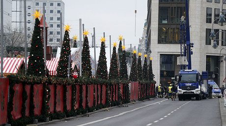 Workers place concrete barriers outside the Christmas market at Breitscheid square in Berlin, Germany, December 22, 2016, following an attack by a truck which ploughed through a crowd at the market on Monday night. © Hannibal Hanschke - Polish Driver Who ‘fought Back’ Against Berlin Attacker Hailed As Hero — RT News