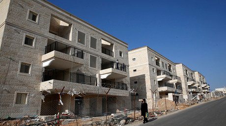 An ultra-Orthodox Jewish man walks past buildings under construction in the Israeli settlement of Beitar Ilit, in the occupied West Bank December 22, 2016. © Baz Ratner - Israel To Approve 100s Of New Homes In East Jerusalem In Defiance Of UNSC Resolution – Reports — RT News