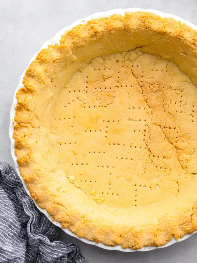 Top-down view of a baked gluten-free pie crust. - Gluten-Free Almond Flour Pie Crust