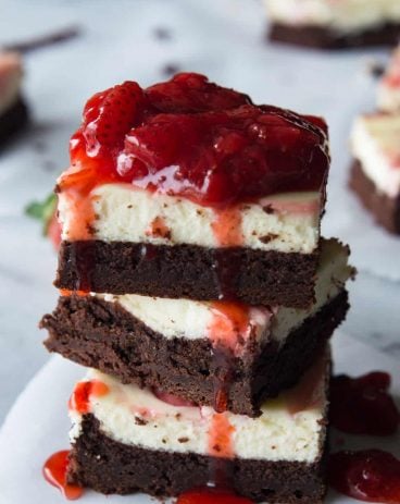 Strawberry Cheesecake Brownies. These homemade brownies are loaded up with a layer of creamy cheesecake then swirled with a sweet strawberry sauce for a pop of color and flavor! Spoon the extra strawberry sauce over the top for an extra special dessert! - Cheesecake Cookies