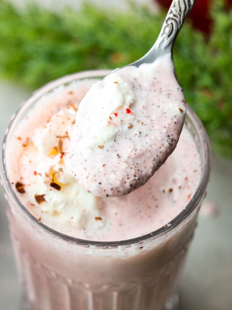 Closeup of a peppermint milkshake with a spoon scooping some out. - Copycat Chick-Fil-A Peppermint Milkshake