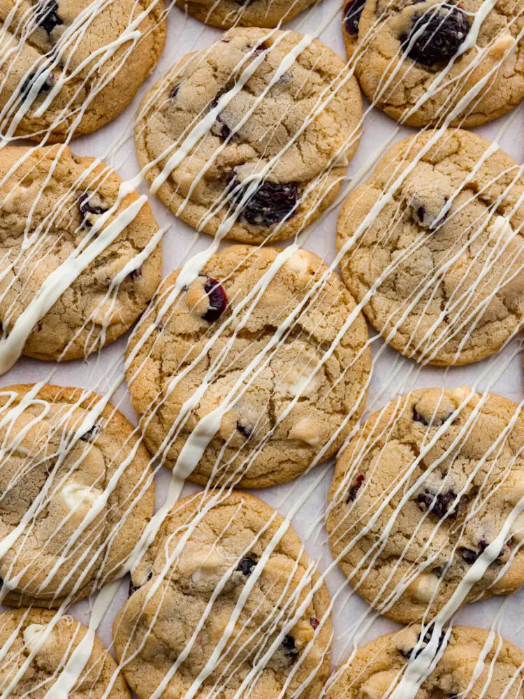 The top view of the cookies drizzled with a vanilla glaze. - White Chocolate Cherry Cranberry Cookies