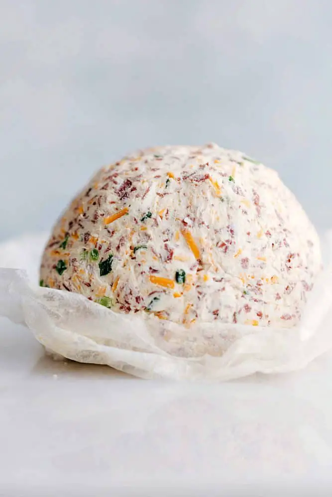 Chipped beef cheese ball on parchment paper. - Easy Chipped Beef Cheese Ball