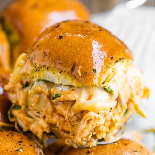 A close up of a buffalo chicken slider. - Game Day Appetizers Roundup