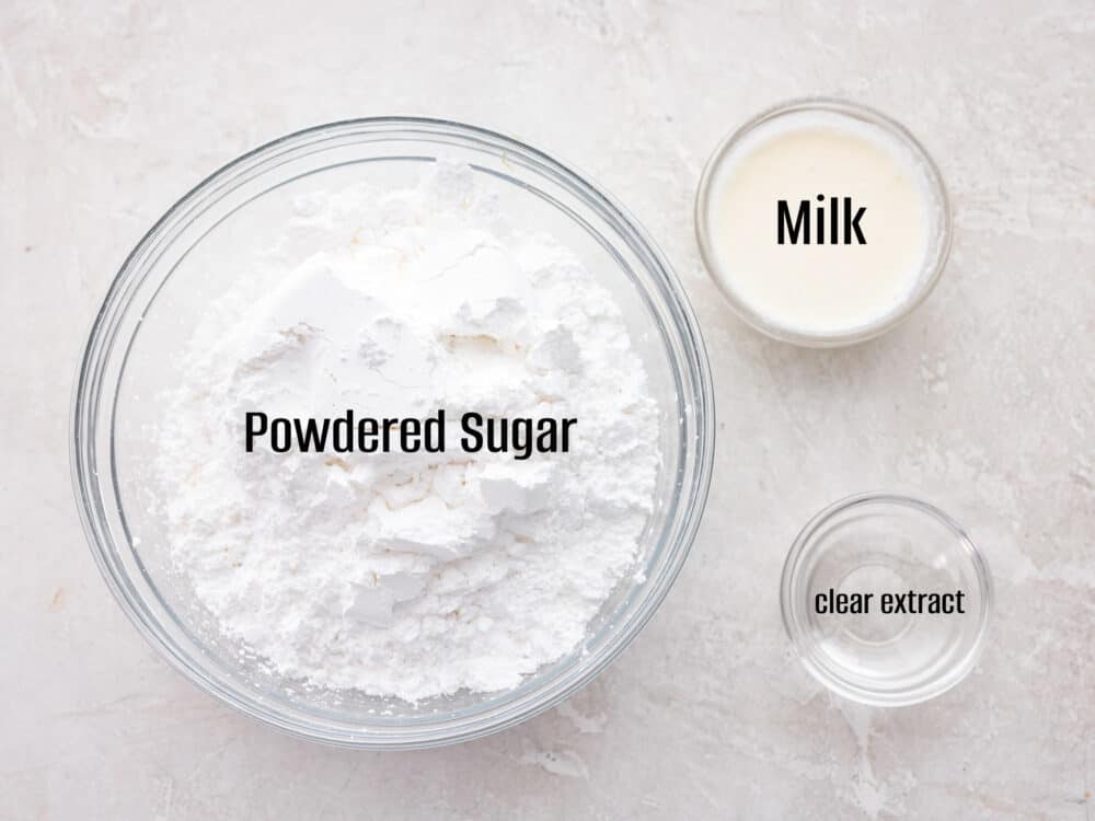 Ingredients to make the glaze in glass bowls. - Powdered Sugar Glaze