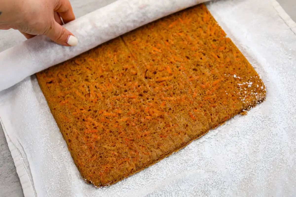 The carrot cake being unrolled - Carrot Cake Roll