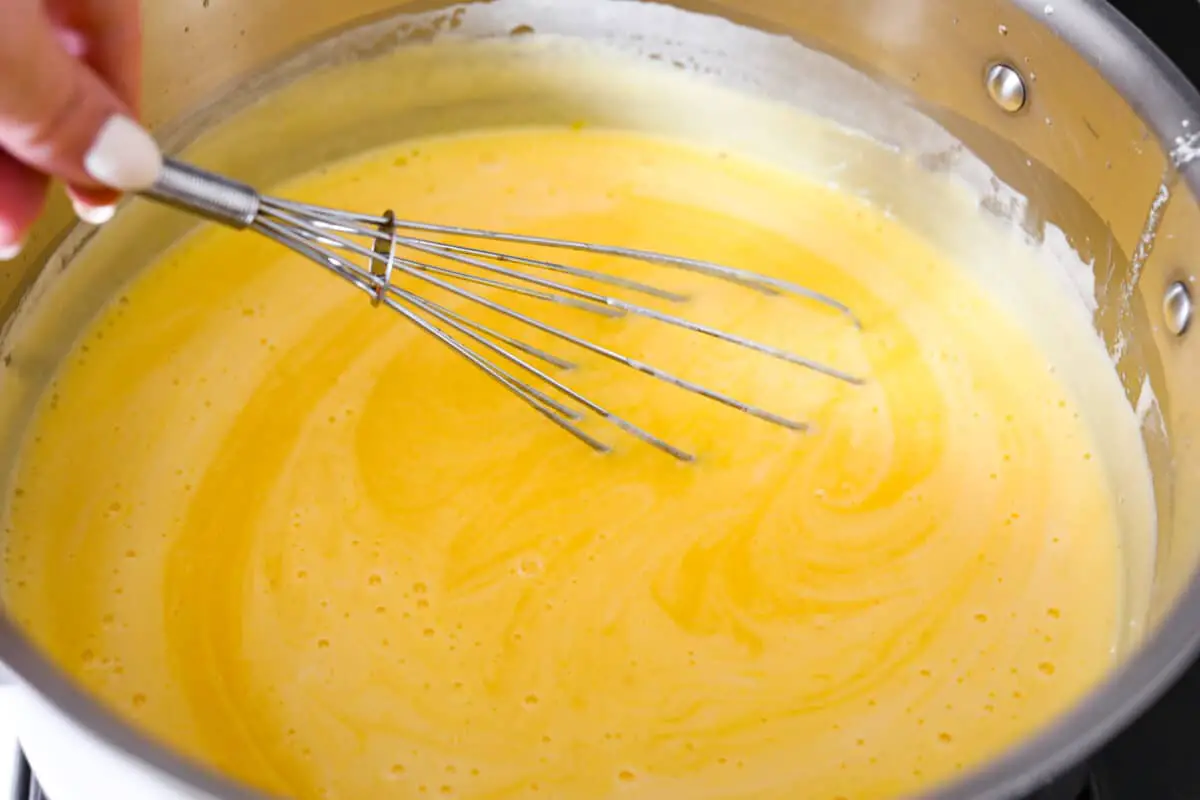 Whisking the egg mixture together. - Lemon Tiramisu