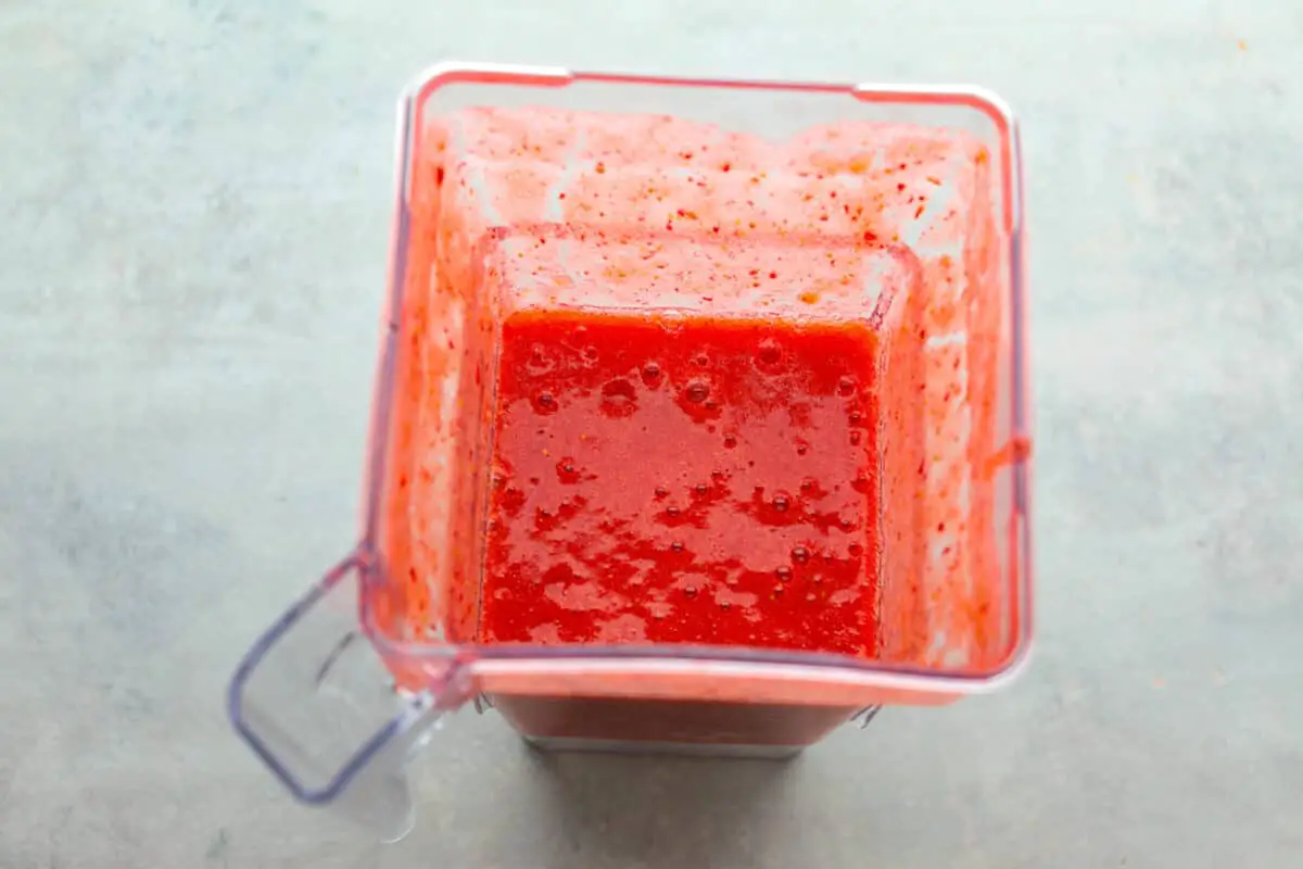Process photo of the strawberry puree blended in a blender. - Strawberry Horchata